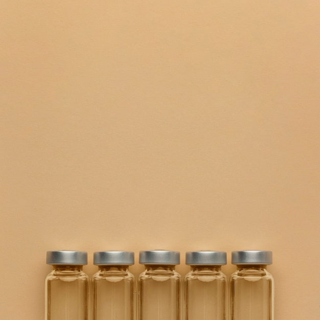 Six small sample bottles laid out beside a patch-test card