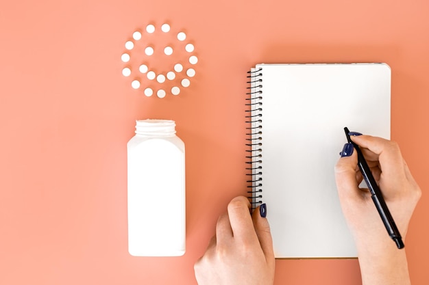 Formulator's notebook open beside skincare bottles for a consultation session