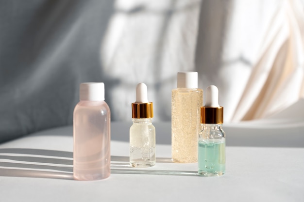 Skincare bottles arranged in a morning and evening order on a shelf