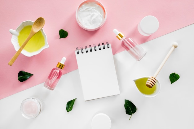 Formulator's notebook open beside skincare bottles for a consultation session